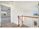 Hallway featuring neutral-toned walls, carpeted flooring, and an open doorway to the next room at 3829 Odessa St, Denver, CO 80249