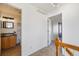 Hallway with a view into the half bathroom and an open door showcasing the interior at 3829 Odessa St, Denver, CO 80249