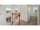 Bright hallway with staircase and natural light coming from two large windows at 3829 Odessa St, Denver, CO 80249