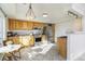 Bright kitchen featuring natural wood cabinets, stainless steel appliances, and a cozy dining area at 3829 Odessa St, Denver, CO 80249