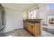 Kitchen featuring stainless steel appliances, tiled floors, a breakfast bar, and an exterior view at 3829 Odessa St, Denver, CO 80249