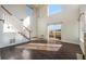 Open-concept living room featuring hardwood floors, lots of natural light, staircase, and a sliding glass door at 3829 Odessa St, Denver, CO 80249