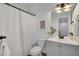 Bathroom featuring a shower and bathtub with a white shower curtain and vanity sink at 4305 W 118Th Pl, Westminster, CO 80031