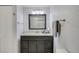 Bathroom with a vanity, mirror, sink, and towel rack with towels at 4305 W 118Th Pl, Westminster, CO 80031