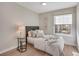 Cozy bedroom with light-colored walls, luxury vinyl flooring, and a sunny window at 4305 W 118Th Pl, Westminster, CO 80031
