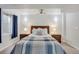 Bedroom showcasing a ceiling fan, large bed with nightstands and overhead sconce lighting at 4305 W 118Th Pl, Westminster, CO 80031