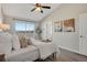 Bright bedroom featuring a high ceiling, window, and neutral décor at 4305 W 118Th Pl, Westminster, CO 80031