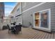 Back deck with an outdoor dining set and gray-painted exterior at 4305 W 118Th Pl, Westminster, CO 80031