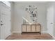 Bright entryway featuring modern console table with art and light hardwood floors at 4305 W 118Th Pl, Westminster, CO 80031