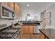 Bright, modern kitchen with stainless steel appliances and a breakfast bar island at 4305 W 118Th Pl, Westminster, CO 80031