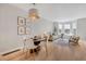 Inviting dining area flows into the light-filled living room with large bay windows at 4305 W 118Th Pl, Westminster, CO 80031