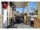 Inviting front porch with rocking chairs and brick columns at 1866 Hogan Ct, Castle Rock, CO 80109