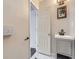 Small bathroom with vanity, mirror and door to bedrooms at 3259 N Adams St, Denver, CO 80205