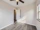 Spacious bedroom with hardwood floors and an open door to hallway at 3259 N Adams St, Denver, CO 80205