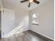 Well-lit bedroom with hardwood floors, a ceiling fan, and a window at 3259 N Adams St, Denver, CO 80205
