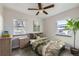 Charming bedroom with hardwood floors, ceiling fan, and stylish decor at 3259 N Adams St, Denver, CO 80205