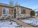 House exterior featuring stone accents and a well-maintained front yard at 3259 N Adams St, Denver, CO 80205