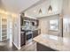 Charming kitchen featuring modern appliances, ample counter space, stylish backsplash, and convenient island at 3259 N Adams St, Denver, CO 80205
