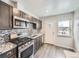 Stylish kitchen boasting stainless steel appliances, sleek cabinets, and a modern backsplash at 3259 N Adams St, Denver, CO 80205