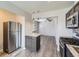 Open kitchen featuring an island with granite countertops and stainless steel appliances at 3259 N Adams St, Denver, CO 80205
