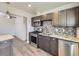 Updated kitchen featuring stainless steel appliances, granite countertops, and stylish mosaic backsplash at 3259 N Adams St, Denver, CO 80205