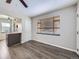 Inviting living room featuring wood floors, a window, and open access to the kitchen area at 3259 N Adams St, Denver, CO 80205