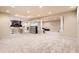 Expansive finished basement with a wet bar, carpeted floor and plenty of entertaining space at 10456 Carriage Club Dr, Lone Tree, CO 80124
