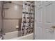 Bathroom featuring a shower-tub combo with a car-themed curtain and a neutral color palette at 10456 Carriage Club Dr, Lone Tree, CO 80124