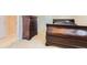 This bedroom has carpet and a simple design with a bed and dresser at 10456 Carriage Club Dr, Lone Tree, CO 80124