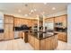 Spacious kitchen with maple cabinets, granite countertops, and stainless steel appliances at 10456 Carriage Club Dr, Lone Tree, CO 80124
