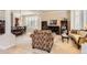 Elegant living room with plantation shutters, decorative columns, and adjacent formal dining area at 10456 Carriage Club Dr, Lone Tree, CO 80124