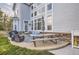 Inviting patio with outdoor dining set, grill, and comfortable seating area at 10456 Carriage Club Dr, Lone Tree, CO 80124