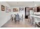 Cozy dining area next to the kitchen, complete with a wooden table and chair set and modern decor at 330 High Point Dr # B102, Longmont, CO 80504