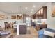 Well-lit kitchen and dining area featuring stainless steel appliances and ample cabinet space at 330 High Point Dr # B102, Longmont, CO 80504