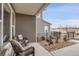 Inviting side patio offers a relaxing retreat with comfortable wicker chairs and a charming garden at 330 High Point Dr # B102, Longmont, CO 80504