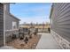 Spacious side patio with wrought iron fence and garden provides a tranquil outdoor space at 330 High Point Dr # B102, Longmont, CO 80504