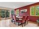 Elegant dining room featuring wood floors, and a view of the outdoor balcony at 4230 S Meadow Brook Ln, Evergreen, CO 80439