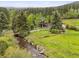 Stunning home nestled in nature, with a creek flowing nearby at 4230 S Meadow Brook Ln, Evergreen, CO 80439