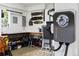 An EV charging station sits installed in this home's clean and tidy garage at 4230 S Meadow Brook Ln, Evergreen, CO 80439