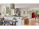 Open kitchen featuring an island with seating, stainless steel appliances, and wood floors at 4230 S Meadow Brook Ln, Evergreen, CO 80439