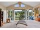 Serene main bedroom boasts vaulted ceilings, balcony access, and picturesque lake views at 4230 S Meadow Brook Ln, Evergreen, CO 80439