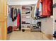Organized walk-in closet featuring shelving and hanging storage for optimal space utilization at 4230 S Meadow Brook Ln, Evergreen, CO 80439