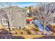 Backyard view showing patio, landscaping, and partial home view at 10551 Applebrook Cir, Highlands Ranch, CO 80130