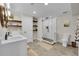 Basement bathroom with double vanity and large shower at 10551 Applebrook Cir, Highlands Ranch, CO 80130