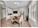 Bright eat-in kitchen area with a round table and white cabinets at 10551 Applebrook Cir, Highlands Ranch, CO 80130