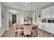 Charming breakfast nook with a round table and white cabinets at 10551 Applebrook Cir, Highlands Ranch, CO 80130