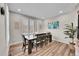 Formal dining room with a large table and hardwood floors at 10551 Applebrook Cir, Highlands Ranch, CO 80130