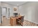 Spacious home office with a large desk and French doors at 10551 Applebrook Cir, Highlands Ranch, CO 80130