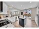 Modern kitchen features stainless steel appliances and a large island at 10551 Applebrook Cir, Highlands Ranch, CO 80130