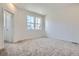 Cozy bedroom with soft carpet, natural light streaming through windows, and neutral tones at 1986 S Haleyville Way, Aurora, CO 80018